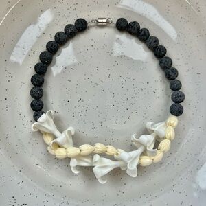 Lava collection double car lei - white puakenikeni, pikake, charcoal beads